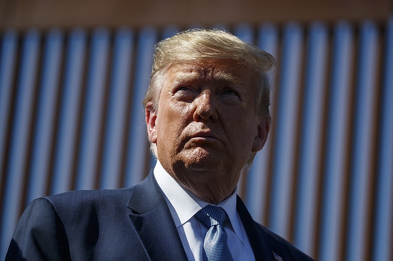 President Donald Trump tours a section of the southern border wall, Wednesday, Sept. 18, 2019, in Otay Mesa, Calif. President Trump is asking a federal judge to block an effort by New York prosecutors to obtain his tax returns. Trump’s attorneys filed a lawsuit Thursday, Sept. 19, 2019, in U.S. District Court in New York.(AP Photo/Evan Vucci)