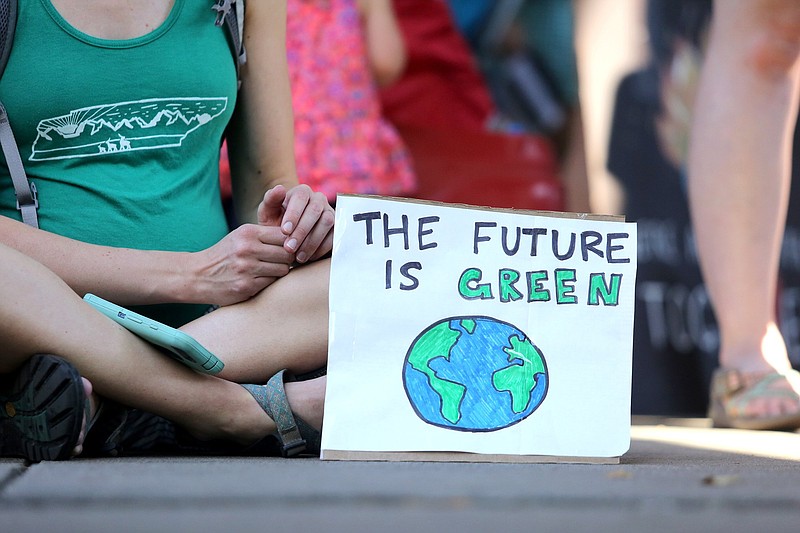 Staff photo by Erin O. Smith / A sign reading "the future is green" is propped up for others to see during a Climate Strike Friday, Sept. 20, 2019 in front of the Tennessee Aquarium in Chattanooga, Tennessee. The event coincides with Global Climate Strike Week.