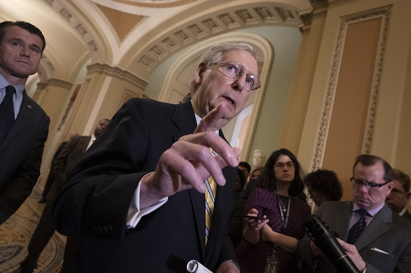 Senate Majority Leader Mitch McConnell, R-Ky., joined at left by Sen. Todd Young, R-Ind., speaks to reporters during a news conference at the Capitol in Washington, Tuesday, Sept. 17, 2019. (AP Photo/J. Scott Applewhite)