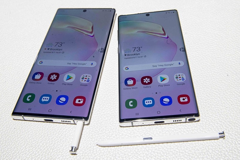 FILE - This Aug. 7, 2019 file photo shows the Samsung Galaxy Note 10, right, and the Galaxy Note 10 Plus on display during a launch event in New York.  (AP Photo/Mary Altaffer, File)


