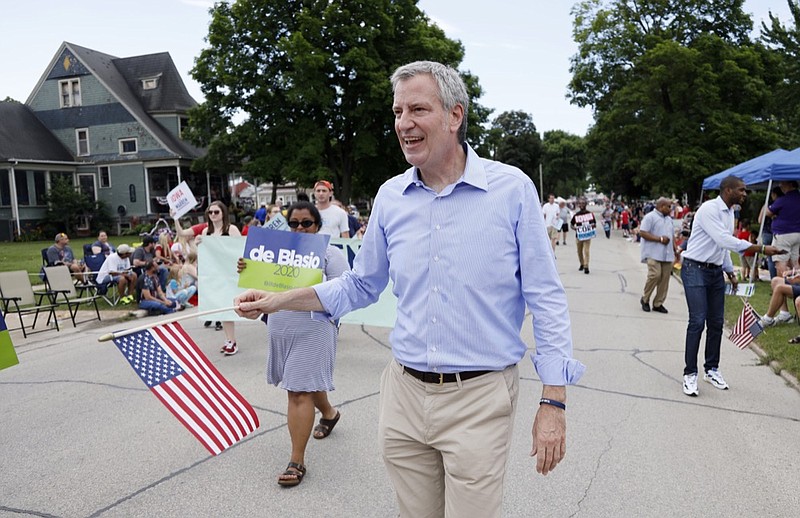 In this July 4, 2019, file photo, Democratic presidential candidate New York Mayor Bill de Blasio walks in the Independence Fourth of July parade in Independence, Iowa. de Blasio said Friday, Sept. 20 that he is ending his campaign for the Democratic presidential nomination. (AP Photo/Charlie Neibergall, File)