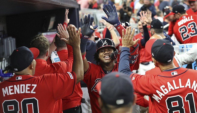 AP file photo by Curtis Compton / Atlanta Braves outfielder Ronald Acuna Jr., center, and the Atlanta Braves are about to start getting ready for a 60-game schedule as Major League Baseball tries to play its 2020 season amid the COVID-19 pandemic.