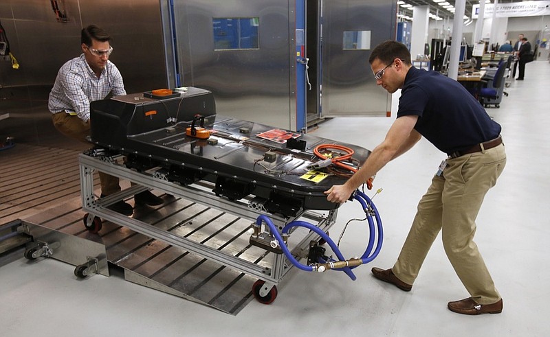 FILE- In this Nov. 4, 2016, file photo, a Chevrolet Bolt EV battery pack is removed for testing after undergoing charging and discharging cycles at General Motors Warren Technical Center's Advanced Energy Center in Warren, Mich. If U.S. consumers ever ditch fuel burners for electric vehicles, then the United Auto Workers union is in trouble. Gone would be thousands of jobs at engine and transmission plants across the industrial Midwest, replaced by smaller workforces at squeaky-clean mostly automated factories that mix up chemicals to make batteries. (AP Photo/Duane Burleson, File)


