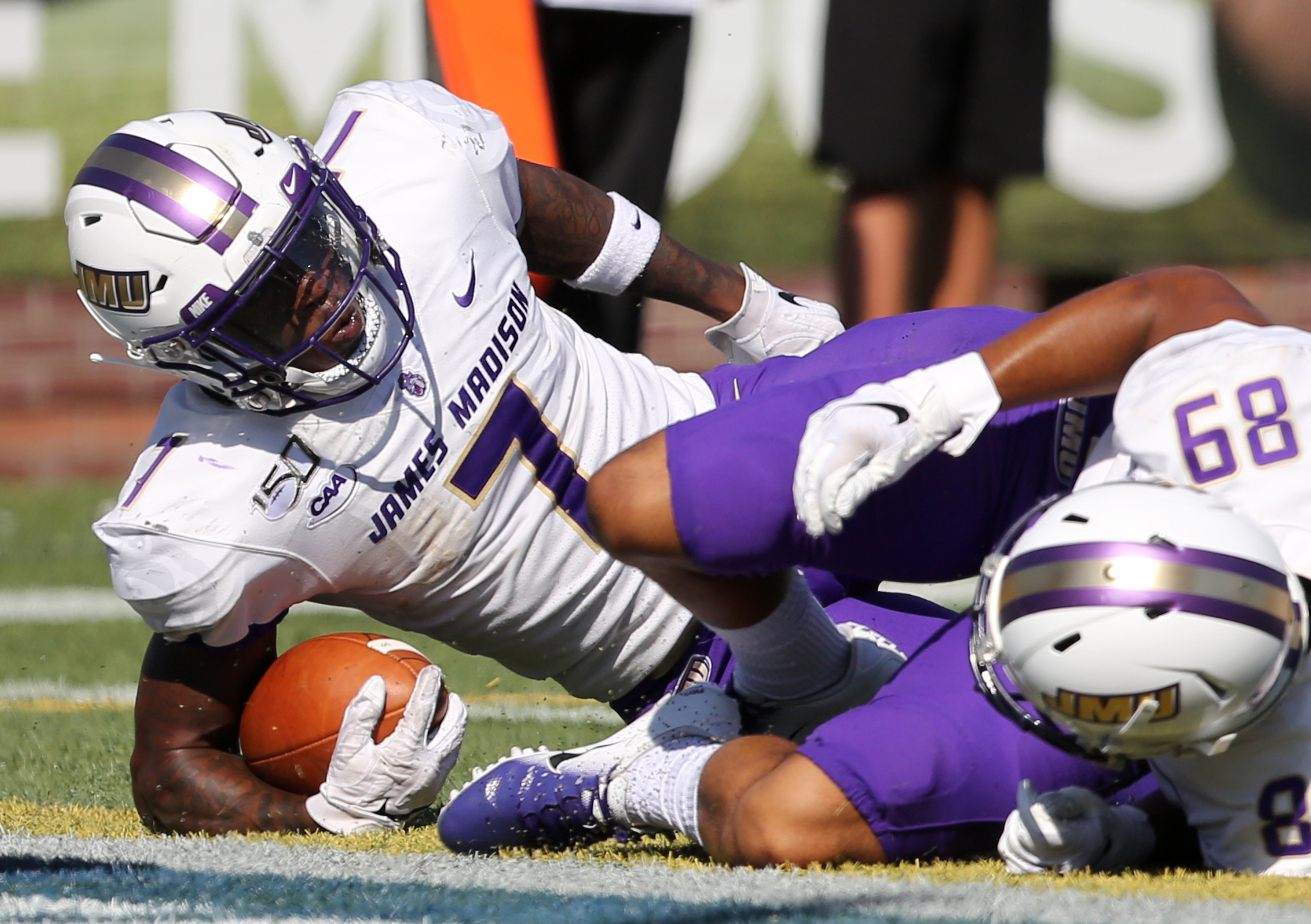 Staff photo by Erin O. Smith / James Madison University running back Jawon Hamilton (7) scores during the UTC vs. James Madison University NCAA football game Saturday, August 21, 2019 at Finley Stadium in Chattanooga, Tennessee. JMU was up 20-14 at the half.