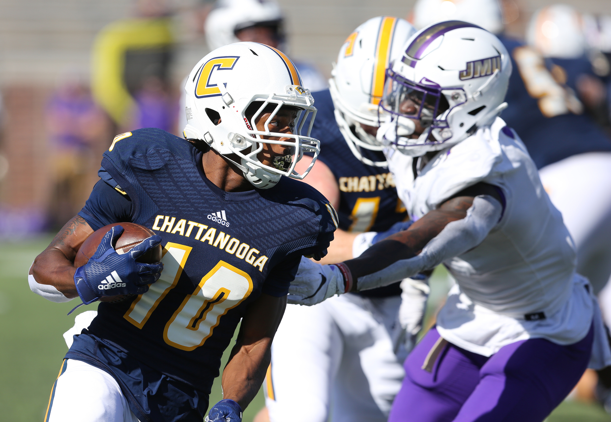 Staff photo by Erin O. Smith / UTC's Lameric Tucker (10) runs the ball during the UTC vs. James Madison University NCAA football game Saturday, August 21, 2019 at Finley Stadium in Chattanooga, Tennessee. JMU was up 20-14 at the half.