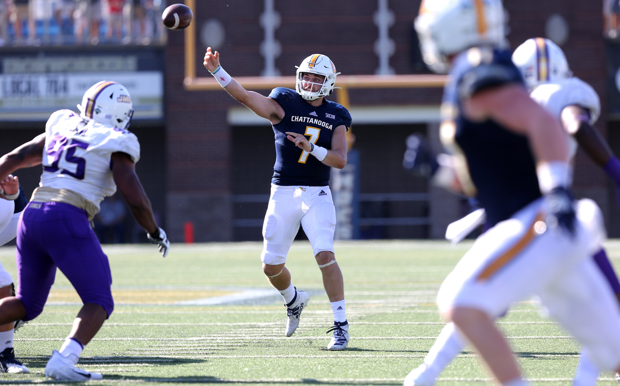 Staff photo by Erin O. Smith / UTC quarterback Nick Tiano (7) throws the ball during the UTC vs. James Madison University NCAA football game Saturday, August 21, 2019 at Finley Stadium in Chattanooga, Tennessee. JMU was up 20-14 at the half.