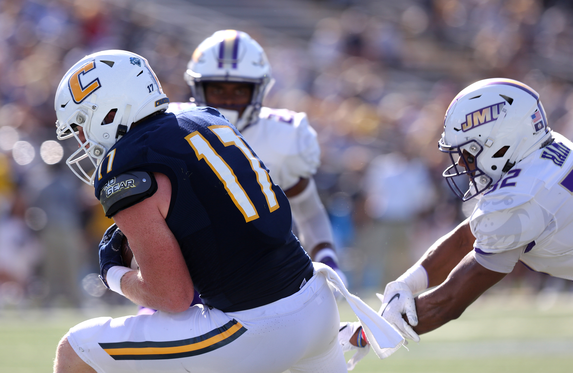 Staff photo by Erin O. Smith / UTC's Chris James (17) catches a pass during the UTC vs. James Madison University NCAA football game Saturday, August 21, 2019 at Finley Stadium in Chattanooga, Tennessee. JMU was up 20-14 at the half.