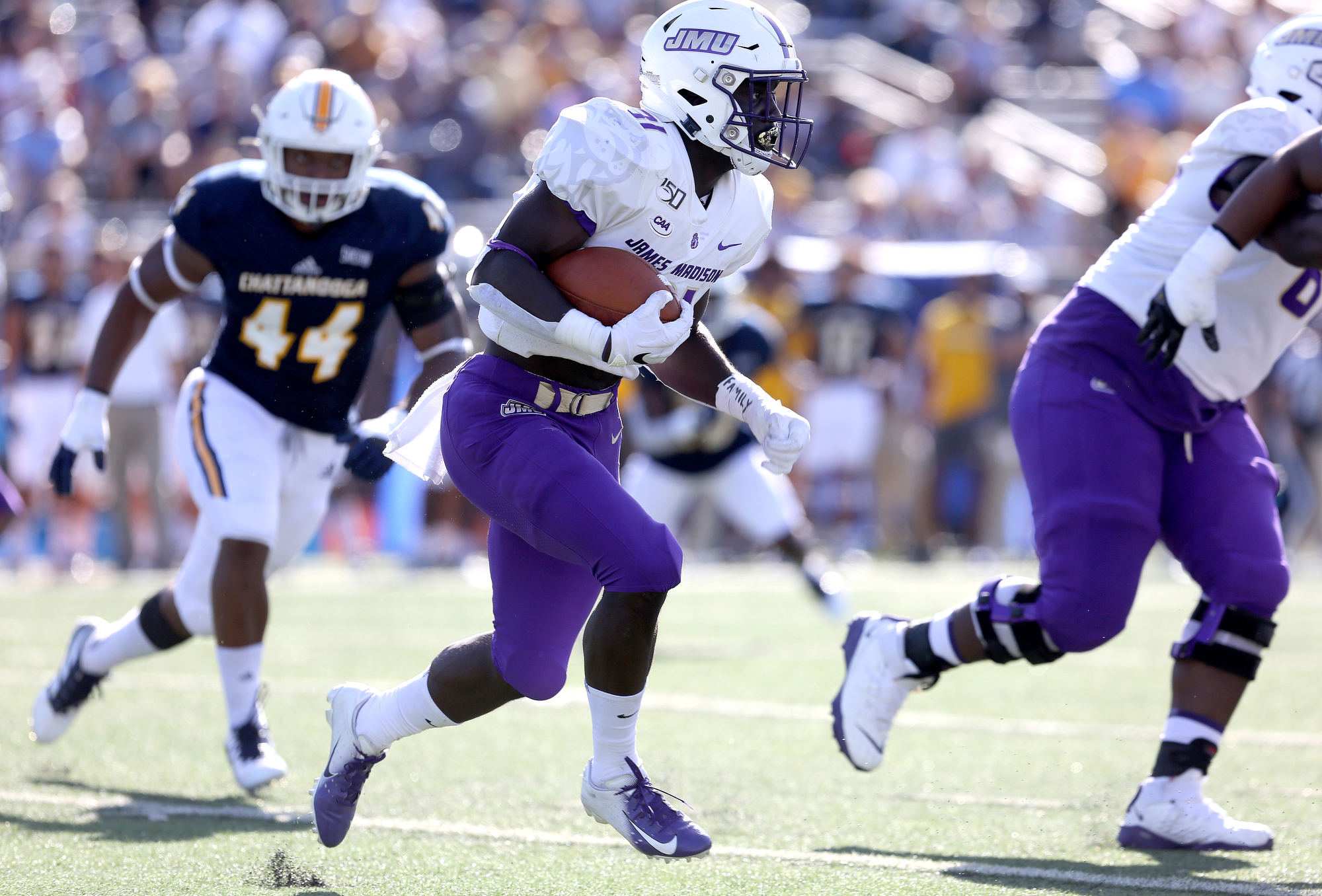 Staff photo by Erin O. Smith / James Madison University's Percy Agyei-Obese runs the ball during the UTC vs. James Madison University NCAA football game Saturday, August 21, 2019 at Finley Stadium in Chattanooga, Tennessee. JMU was up 20-14 at the half.