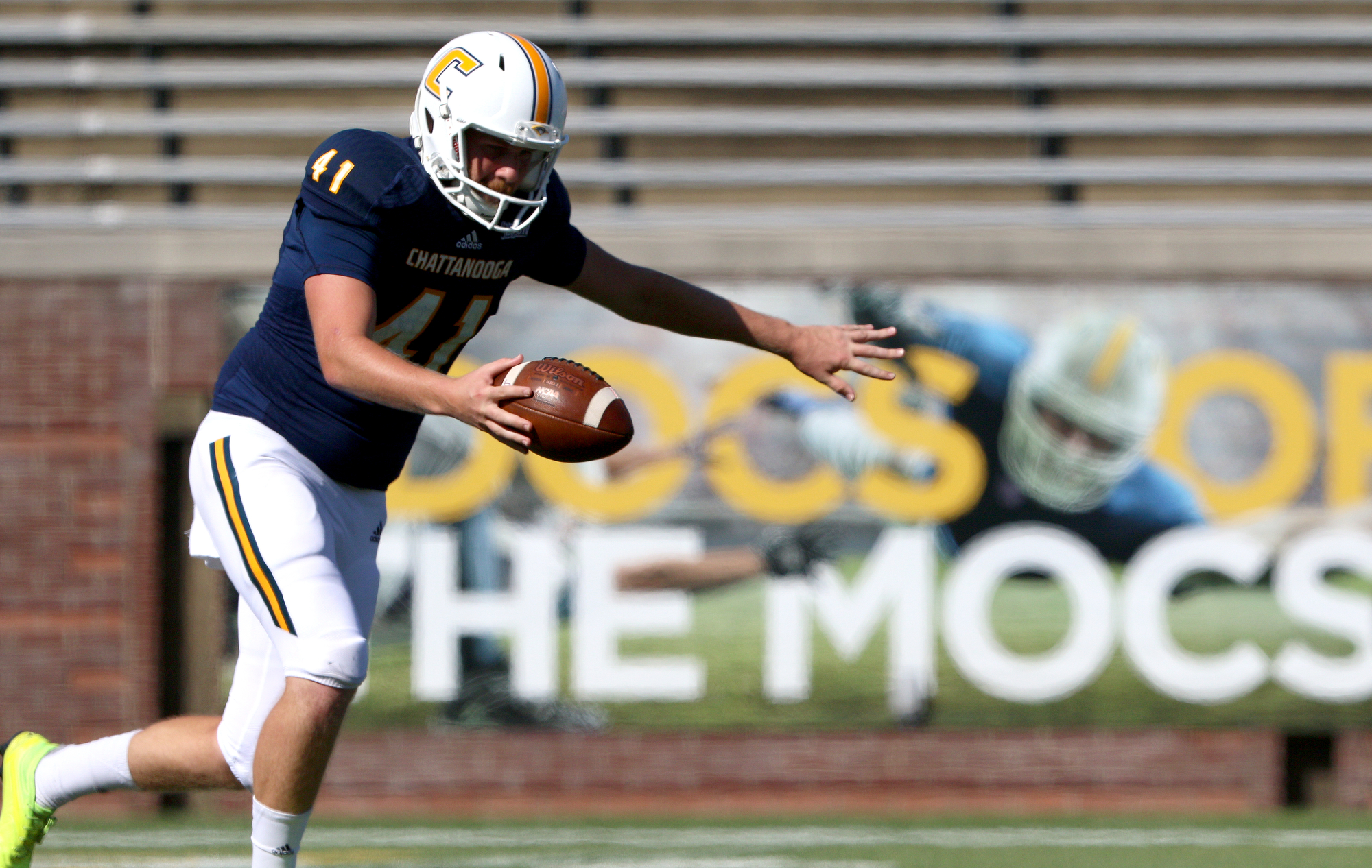 Staff photo by Erin O. Smith / UTC's Colin Brewer (41) punts the ball during the UTC vs. James Madison University NCAA football game Saturday, August 21, 2019 at Finley Stadium in Chattanooga, Tennessee. JMU beat UTC with a score of 37-14.