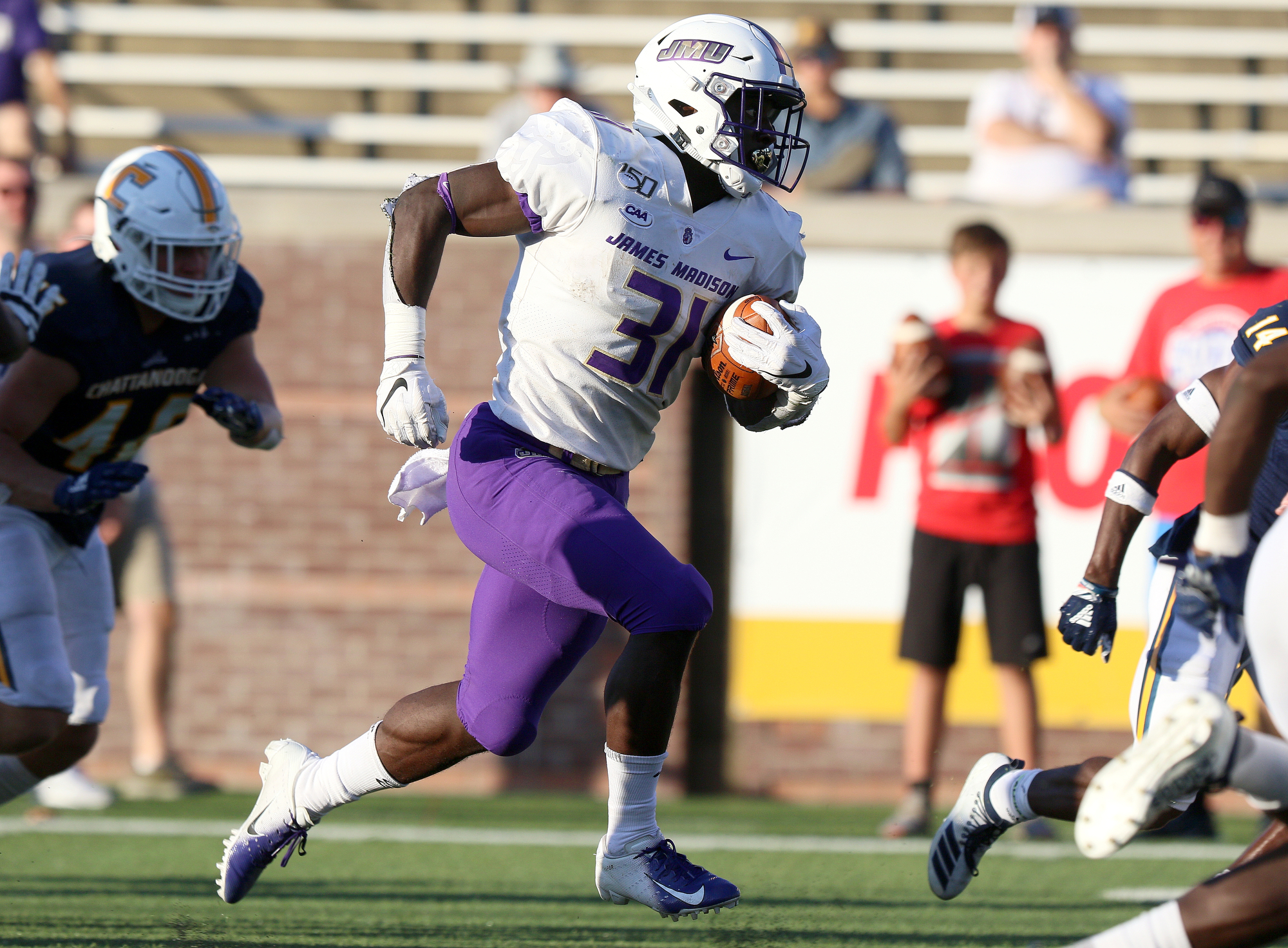 Staff photo by Erin O. Smith / James Madison University's Percy Agyei-Obese (31) runs the ball during the UTC vs. James Madison University NCAA football game Saturday, August 21, 2019 at Finley Stadium in Chattanooga, Tennessee. JMU beat UTC with a score of 37-14.