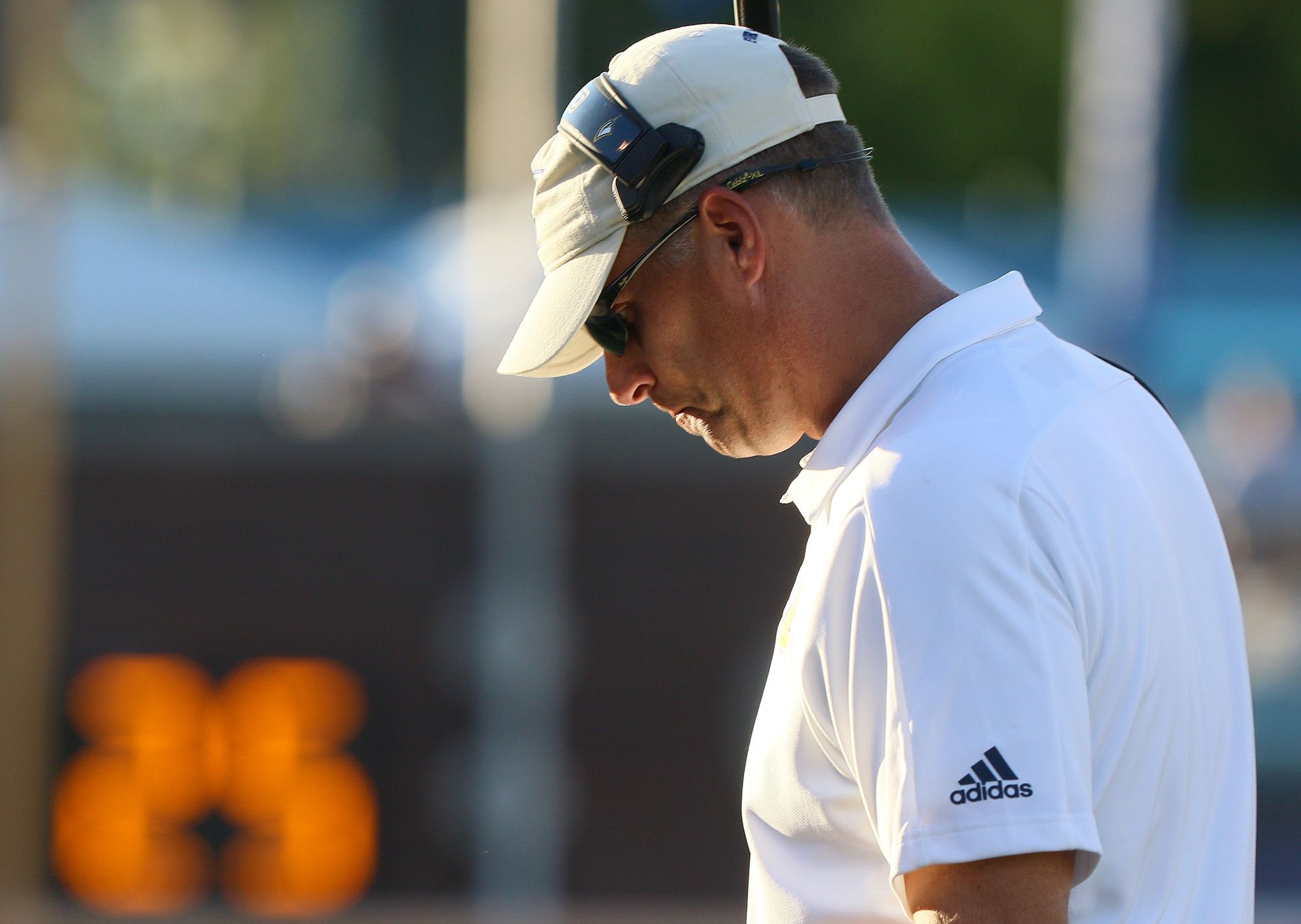 Staff photo by Erin O. Smith / UTC football coach Rusty Wright walks along the sideline during the Mocs' game against James Madison University on Saturday at Finley Stadium.