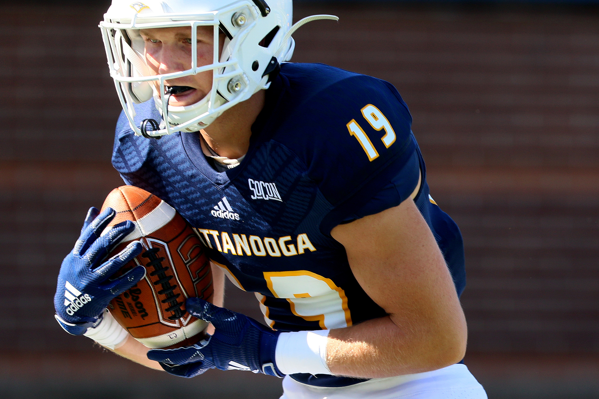 Staff photo by Erin O. Smith / UTC's Bryce Nunnelly (19) runs the ball during the UTC vs. James Madison University NCAA football game Saturday, August 21, 2019 at Finley Stadium in Chattanooga, Tennessee. JMU beat UTC with a score of 37-14.