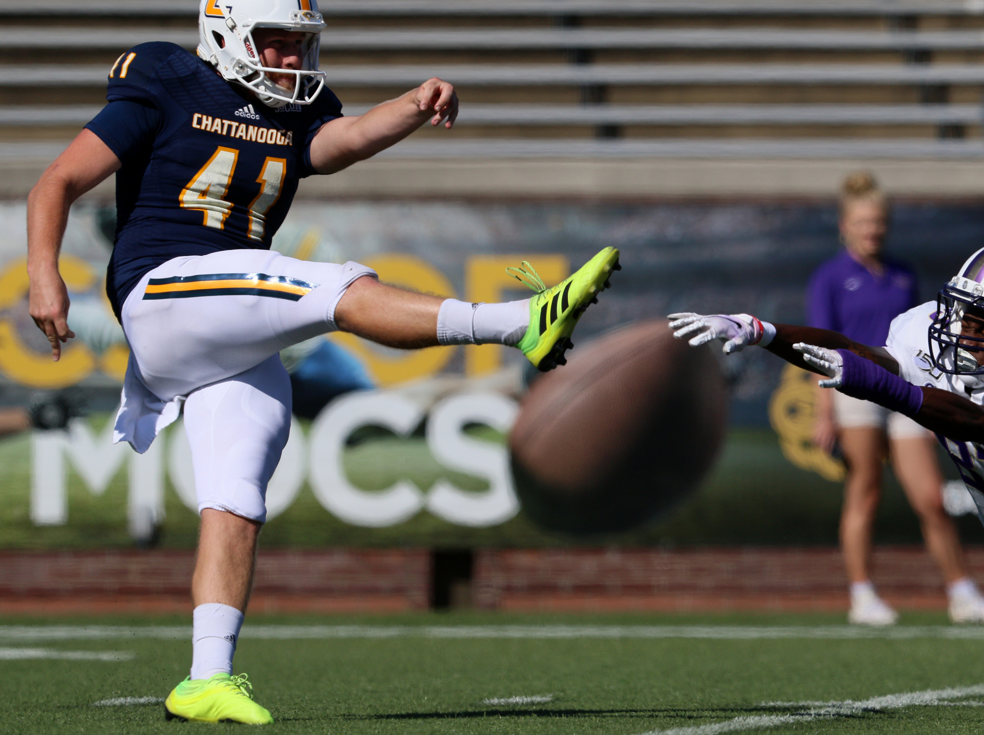 Staff photo by Erin O. Smith / UTC's Colin Brewer (41) gets the punt off before a James Madison University player is able to dive in front of the ball during the UTC vs. James Madison University NCAA football game Saturday, August 21, 2019 at Finley Stadium in Chattanooga, Tennessee. JMU beat UTC with a score of 37-14.