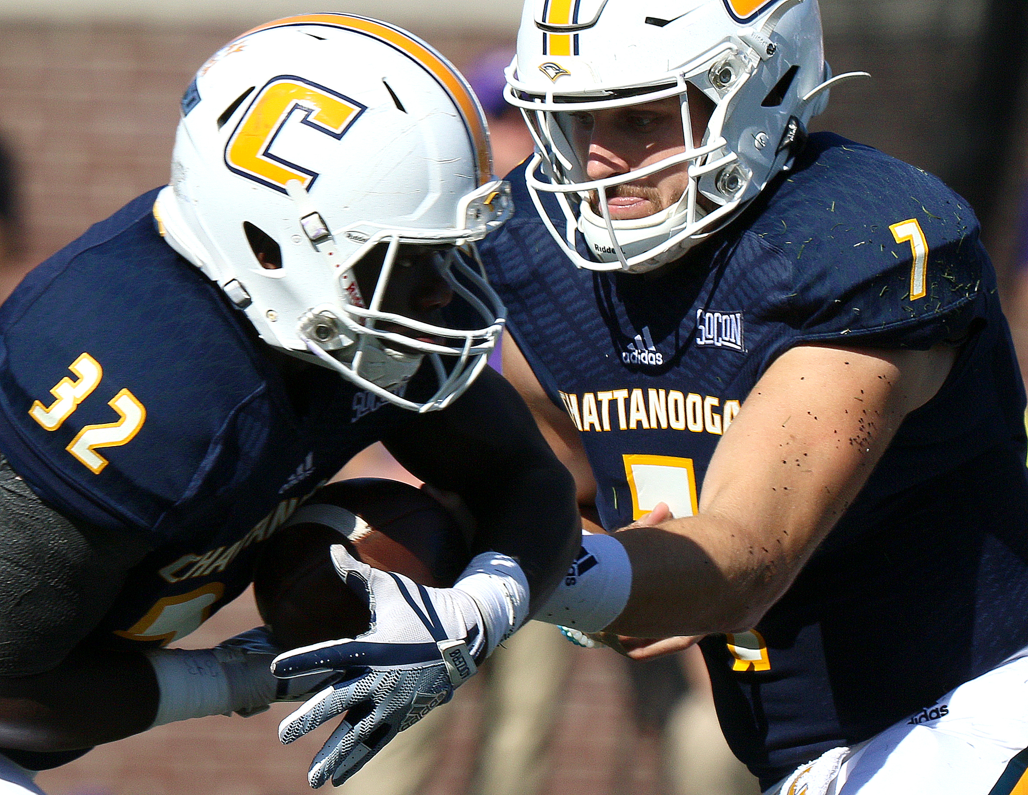 Staff file photo by Erin O. Smith / UTC's Ailym Ford takes the handoff from Nick Tiano during a home game against James Madison University on Sept. 21 at Finley Stadium.