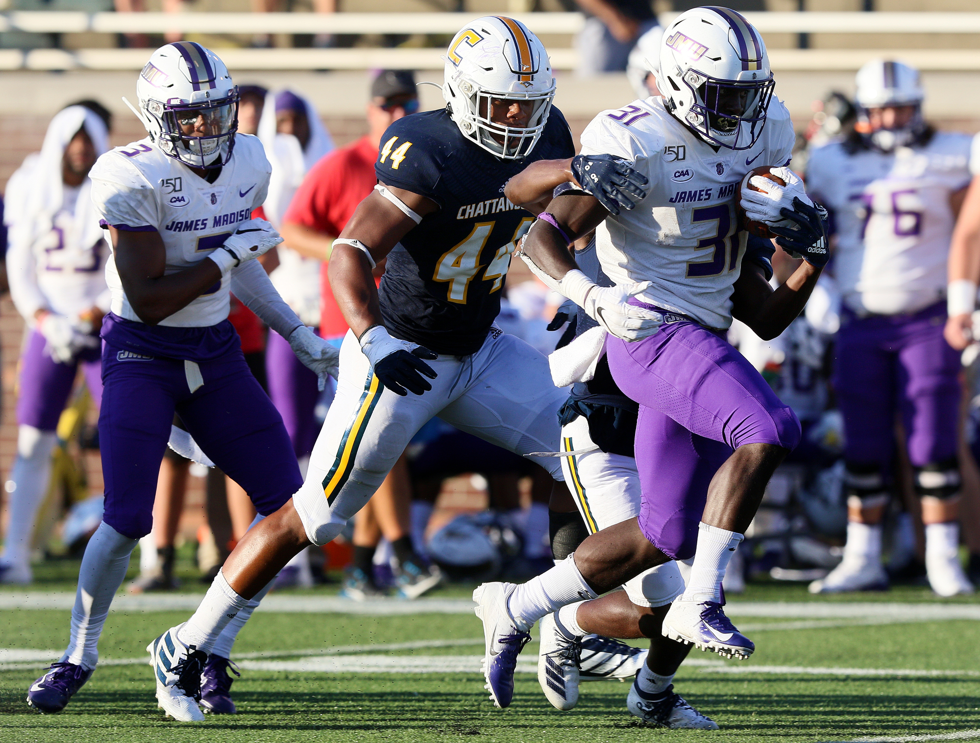 Staff photo by Erin O. Smith / James Madison University's Percy Agyei-Obese (31) runs the ball during the UTC vs. James Madison University NCAA football game Saturday, August 21, 2019 at Finley Stadium in Chattanooga, Tennessee. JMU beat UTC with a score of 37-14.