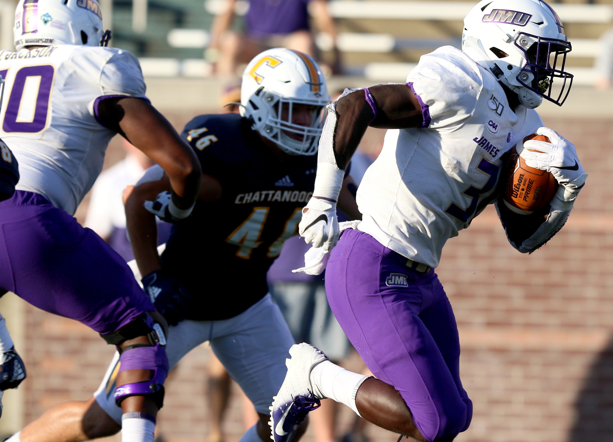 Staff photo by Erin O. Smith / James Madison University's Percy Agyei-Obese (31) runs the ball during the UTC vs. James Madison University NCAA football game Saturday, August 21, 2019 at Finley Stadium in Chattanooga, Tennessee. JMU beat UTC with a score of 37-14.
