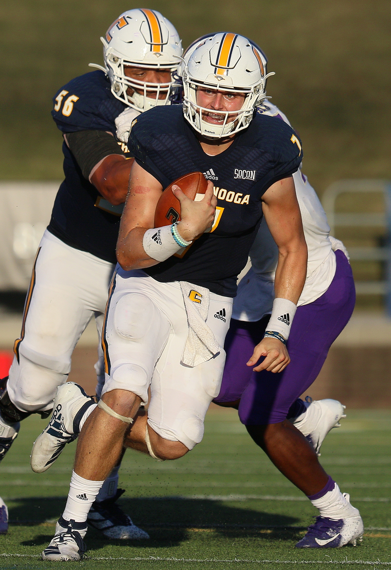 Staff photo by Erin O. Smith / UTC quarterback Nick Tiano (7) runs the ball during the UTC vs. James Madison University NCAA football game Saturday, August 21, 2019 at Finley Stadium in Chattanooga, Tennessee. JMU beat UTC with a score of 37-14.