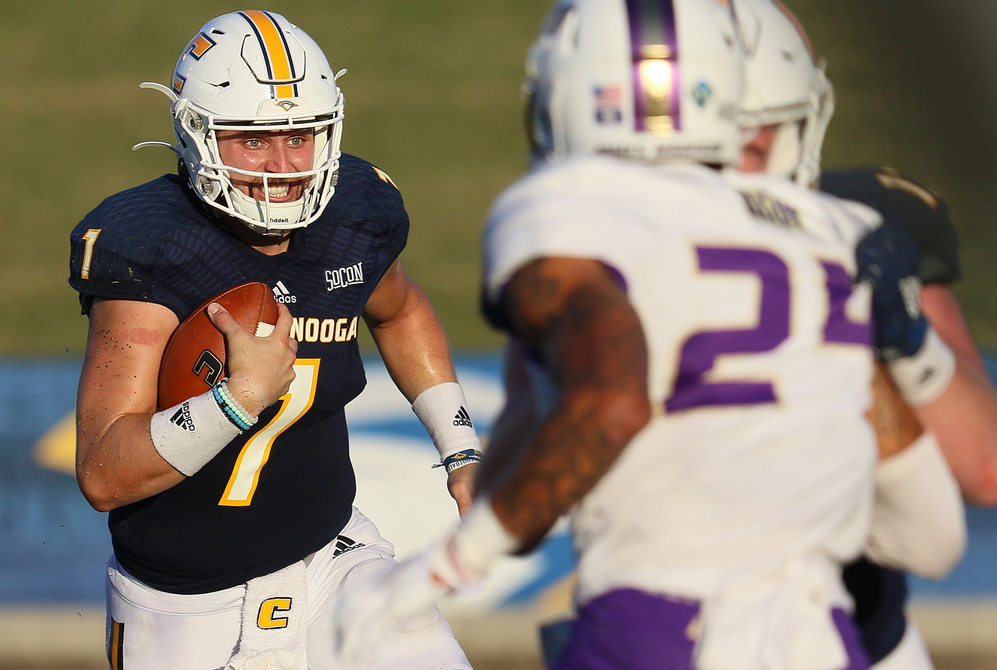 Staff photo by Erin O. Smith / UTC quarterback Nick Tiano (7) runs the ball during the UTC vs. James Madison University NCAA football game Saturday, August 21, 2019 at Finley Stadium in Chattanooga, Tennessee. JMU beat UTC with a score of 37-14.