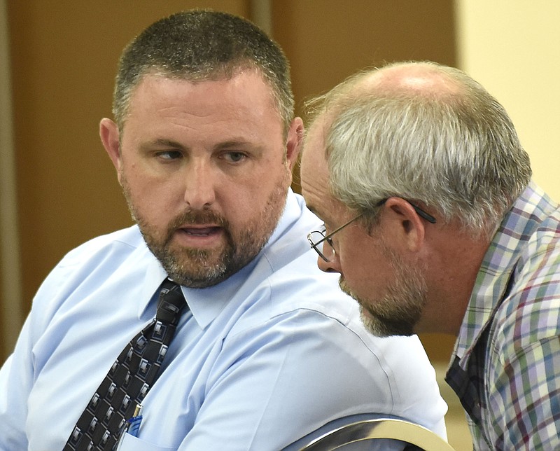 Staff Photo by Robin Rudd / Chattooga County Sheriff Mark Schrader talks to a resident during an Aug. 7, 2017, hearing at the Chattooga County Civic Center in Summerville, Georgia.