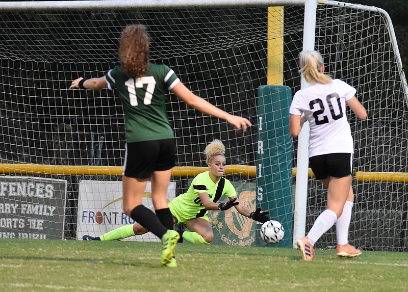 Staff photo by Patrick MacCoon / McMinn County keeper Jaliyah Miller dives to stop a shot by Sarah Moore. Notre Dame fell 4-3 at home on Monday night.
