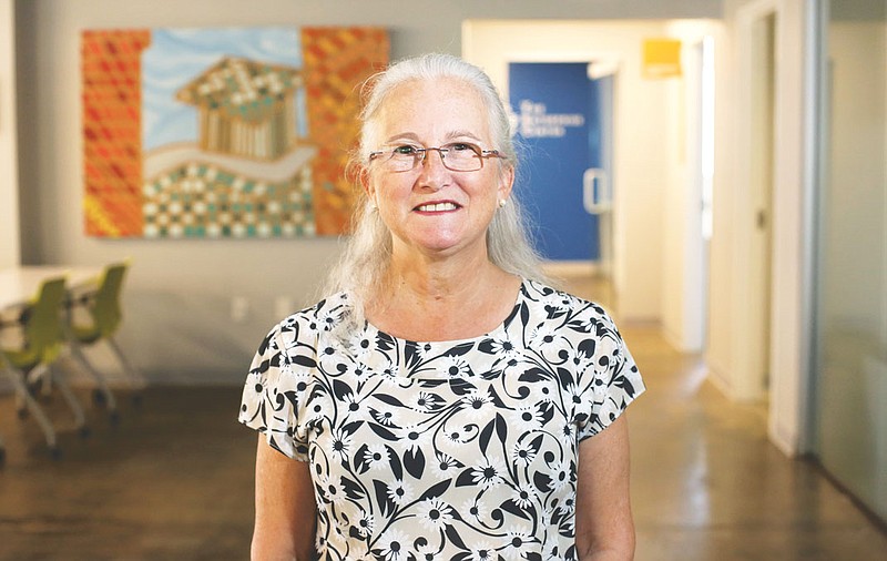 Deb Socia, executive director of the Enterprise Center, stands in the organization's offices in the Edney Building.