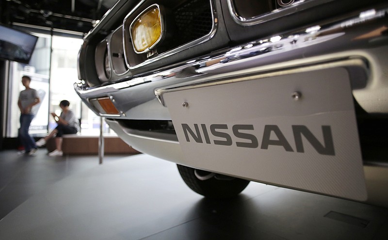 FILE - In this May 11, 2017 file photo, a Nissan car is displayed at its showroom in Tokyo. Nissan is recalling 1.3 million vehicles in the U.S., Canada and other countries to fix a problem with backup camera displays. The recall covers most of the Nissan and Infiniti model lineups from the 2018 and 2019 model years. (AP Photo/Eugene Hoshiko, File)