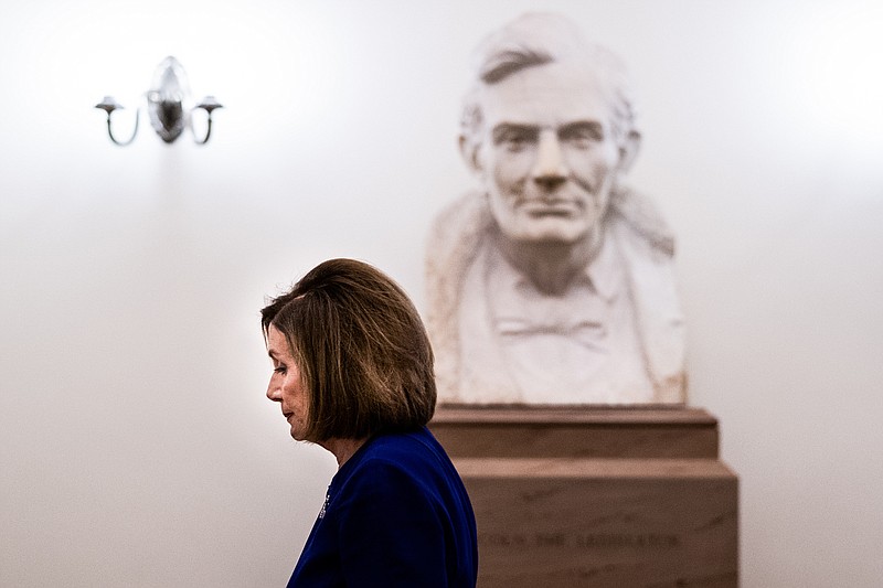 The New York Times / House Speaker Nancy Pelosi, D-California, walks past a bust of President Abraham Lincoln as she walks to her office at the Capitol in Washington on Tuesday before she announced a formal impeachment inquiry against President Donald Trump.