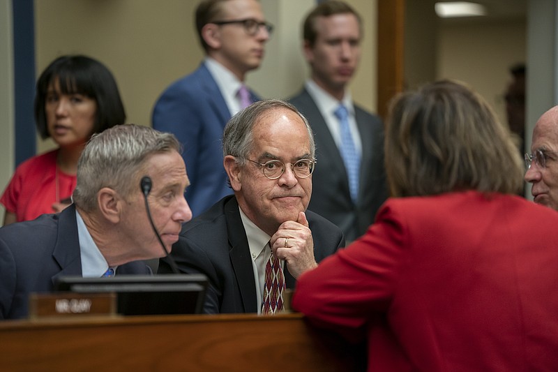 Rep. Jim Cooper, D-Tenn., center, joined at left by Rep. Stephen F. Lynch, D-Mass., confers with other Democrats as the House Oversight and Reform Committee considers whether to hold Attorney General William Barr and Commerce Secretary Wilbur Ross in contempt for failing to turn over subpoenaed documents related to the Trump administration's decision to add a citizenship question to the 2020 census, on Capitol Hill in Washington, Wednesday, June 12, 2019. (AP Photo/J. Scott Applewhite)