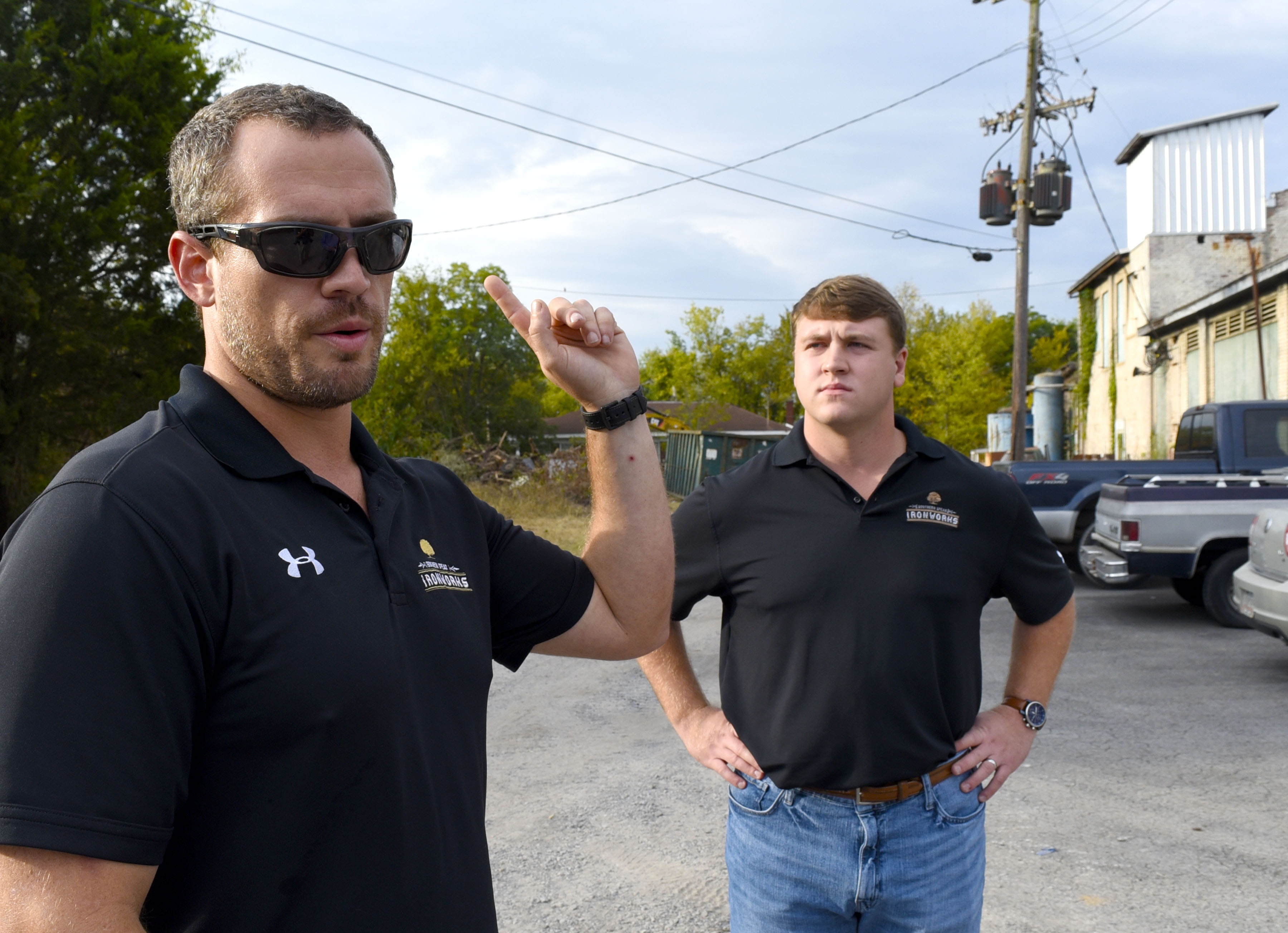 Staff Photo by Robin Rudd/ From left, Southern Spear President and CEO Sean Compton talks about his vision for the industrial site. Listening is Southern Spear Business Development Manager, J.P. Evans. Southern Spear plans to buy the Lucey Boiler plant site, located at 901 S. Holtzclaw Ave. where it will build a mixed-use development. The Times Free Press toured the site on September 26, 2019.