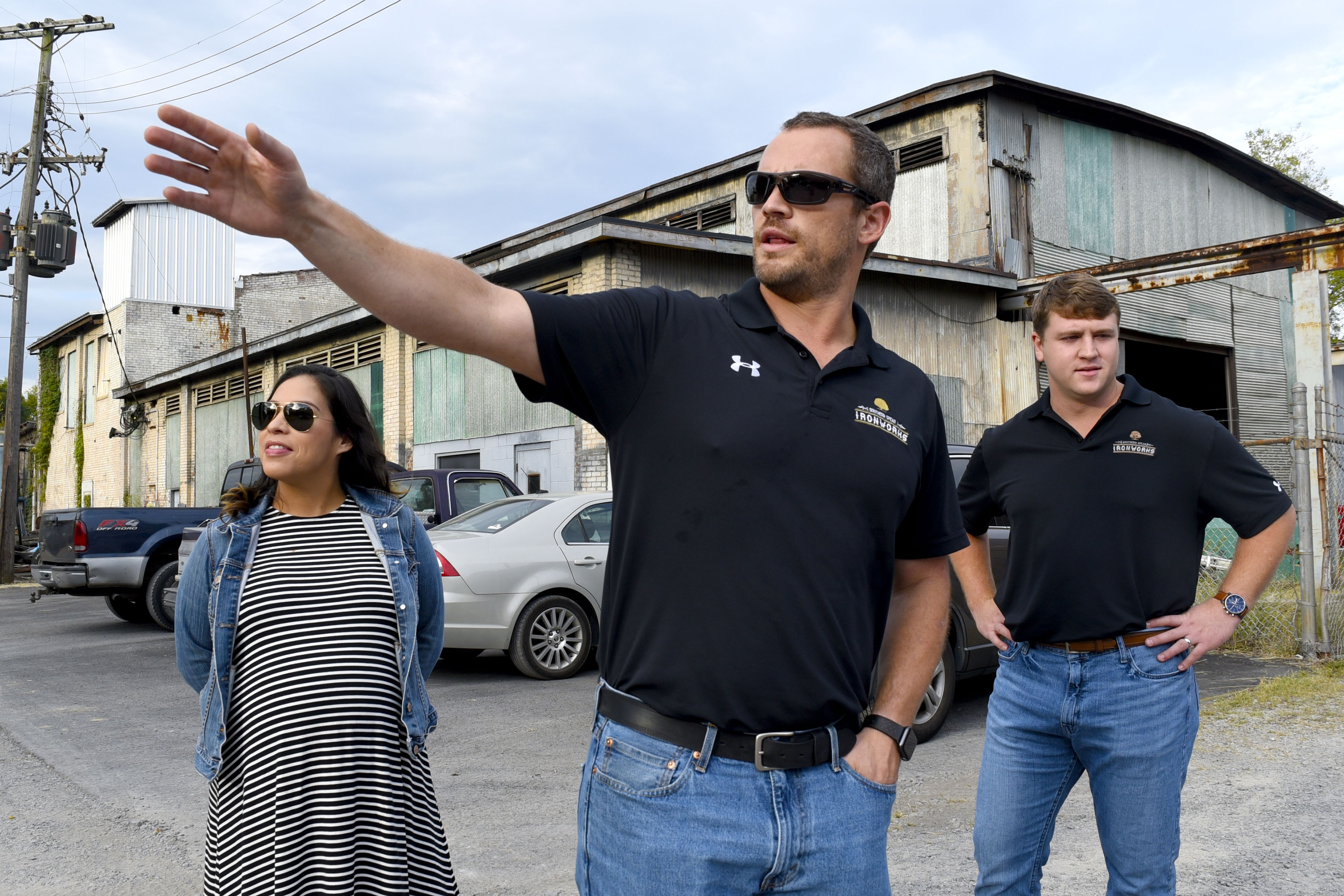 Staff Photo by Robin Rudd/ Southern Spear President and CEO Sean Compton, center, talks about his vision for the industrial site. Listening, Mr. Compton's wife, Lizz, and Southern Spear Business Development Manager, J.P. Evans. Southern Spear plans to buy the Lucey Boiler plant site, located at 901 S. Holtzclaw Ave. where it will build a mixed-use development. The Times Free Press toured the site on September 26, 2019.
