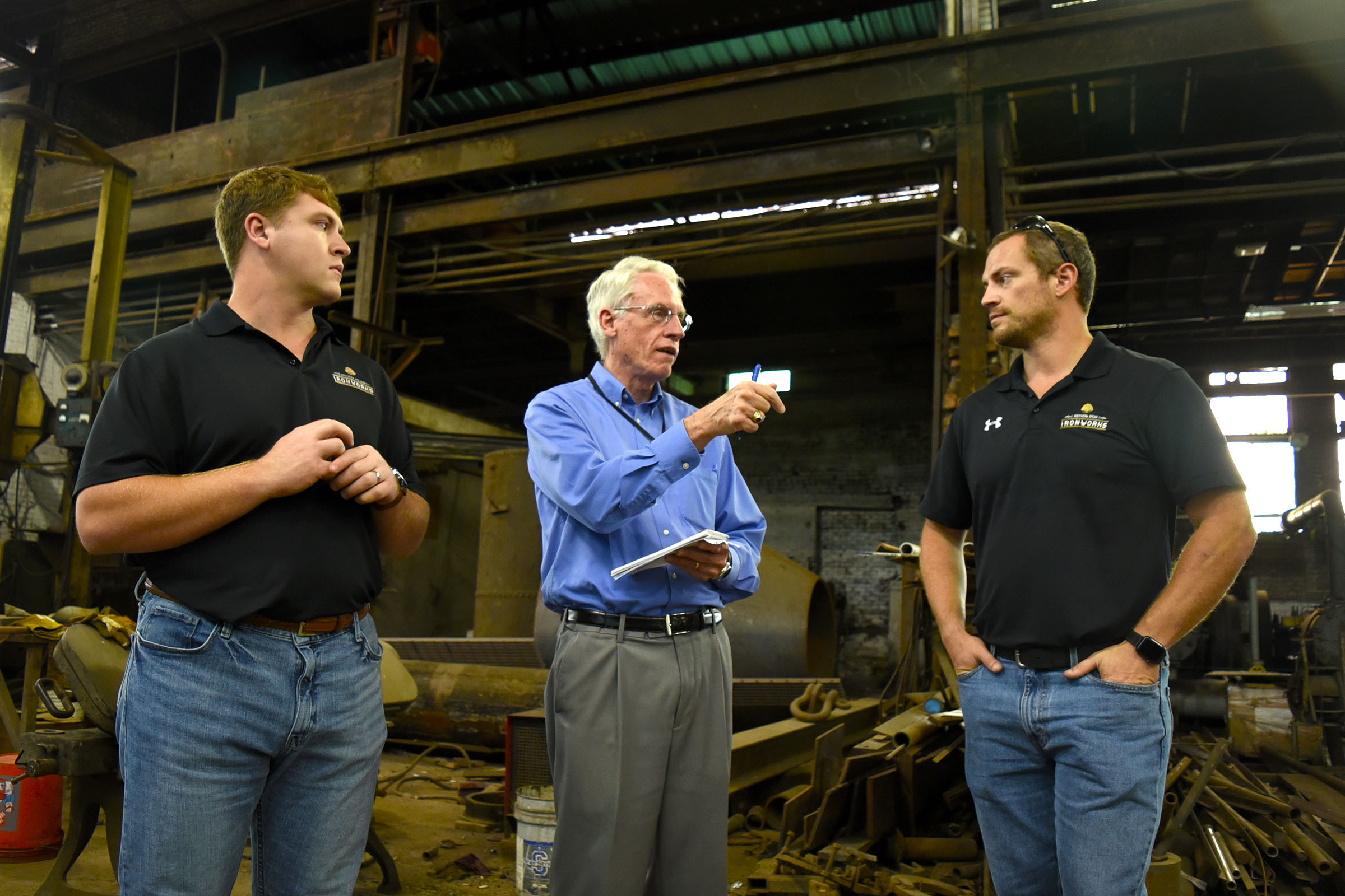 Staff Photo by Robin Rudd/ Times Free Press reporter, Mike Pare, ask a question of Southern Spear President and CEO, Sean Compton. Listening, at left, is Southern Spear Business Development Manager, J.P. Evans. Southern Spear plans to buy the Lucey Boiler plant site, located at 901 S. Holtzclaw Ave. where it will build a mixed-use development. The Times Free Press toured the site on September 26, 2019.