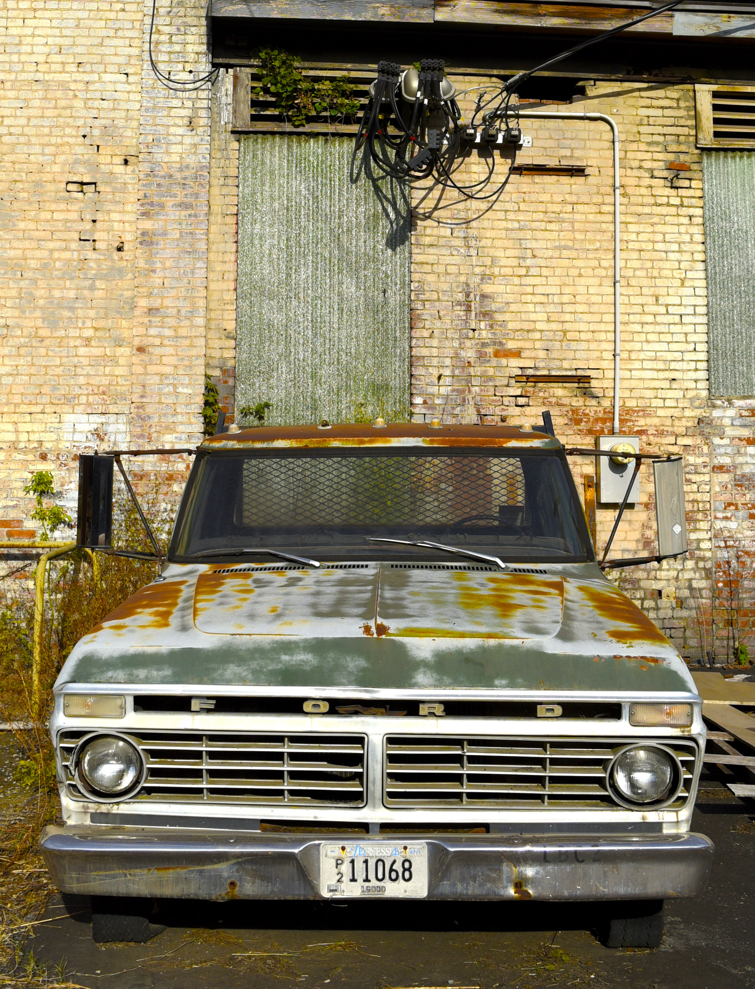 Staff Photo by Robin Rudd/ A old Ford pickup rests outside Lucey Boiler. Southern Spear plans to buy the Lucey Boiler plant site, located at 901 S. Holtzclaw Ave. where it will build a mixed-use development. The Times Free Press toured the site on September 26, 2019.