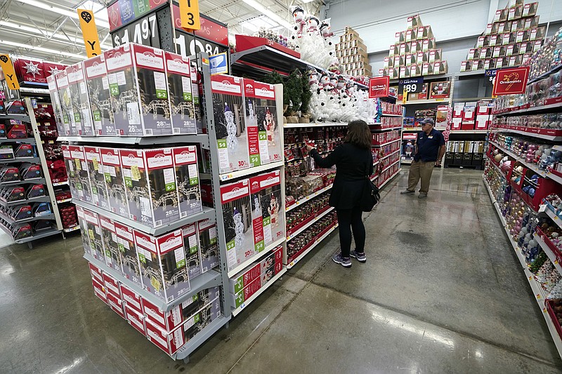 FILE - In this Nov. 9, 2018, file photo Christmas decorations are shown at a Walmart Supercenter  in Houston. Timing is everything when it comes to saving for the holidays. The longer you have to build up cash reserves, plan your budget and buy gifts at the right price, the better you can cover these seasonal costs without going into debt. (AP Photo/David J. Phillip, File)