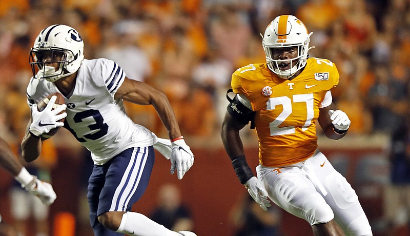 Associated Press photo by Wade Payne / Tennessee freshman linebacker Quavaris Crouch (27) pursues BYU wide receiver Micah Simon during their teams' game at Neyland Stadium on Sept. 7.