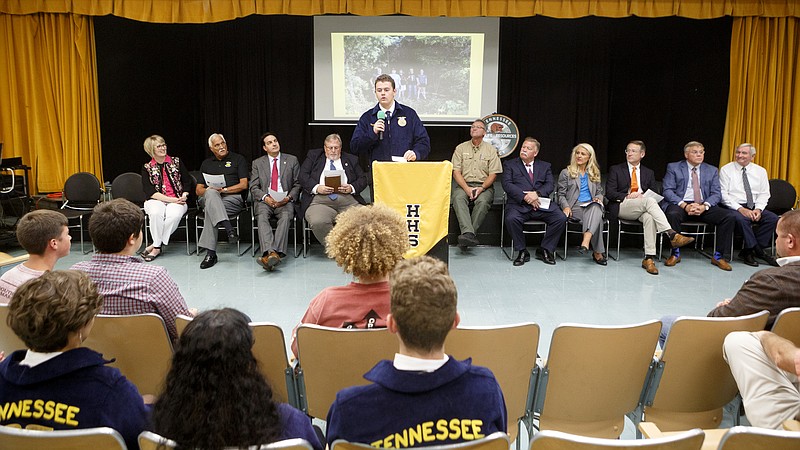 Staff photo by C.B. Schmelter / Hixson High School Future Farmers of America chapter president Tanner Moore, center, speaks during a recognition program in Little Theater at Hixson High School on Thursday, Sept. 26, 2019 in Chattanooga, Tenn. The Tennessee Wildlife Resources Agency recognized Hixsonճ FFA chapter for their work and partnership utilizing local state land. 