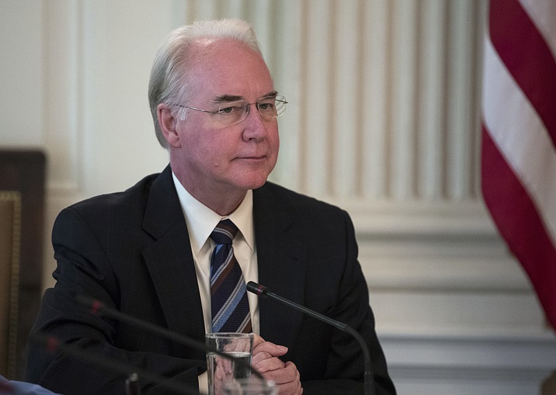 This Sept. 28, 2017, file photo shows then Secretary of Health and Human Services Tom Price attending an opioid roundtable discussion at the White House in Washington. Price is seeking a return ticket to Washington nearly two years after being ousted for excessive travel spending. He submitted an application to Georgia's Republican Gov. Brian Kemp seeking appointment to the U.S. Senate, Kemp spokesman Cody Hall confirmed Thursday, Sept. 26, 2019. (AP Photo/Carolyn Kaster, File)