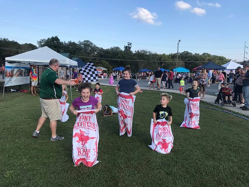 Contributed photo by Chelsea Hoge / Attendees at last year's Fall Festival in Catoosa County compete in a sack race. At the Oct. 5 event, children will receive bags to trick-or-treat at over 50 vendors at the event.