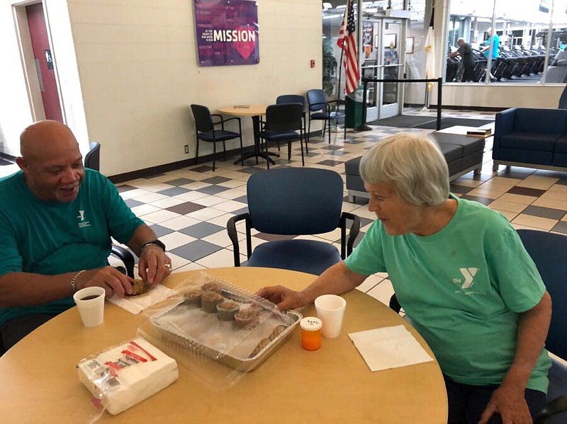 Contributed photo by Jeannette Byerley / Eating muffins baked by Katye Hunt is a highlight of Wednesday mornings for other members of the Hamilton Family YMCA.