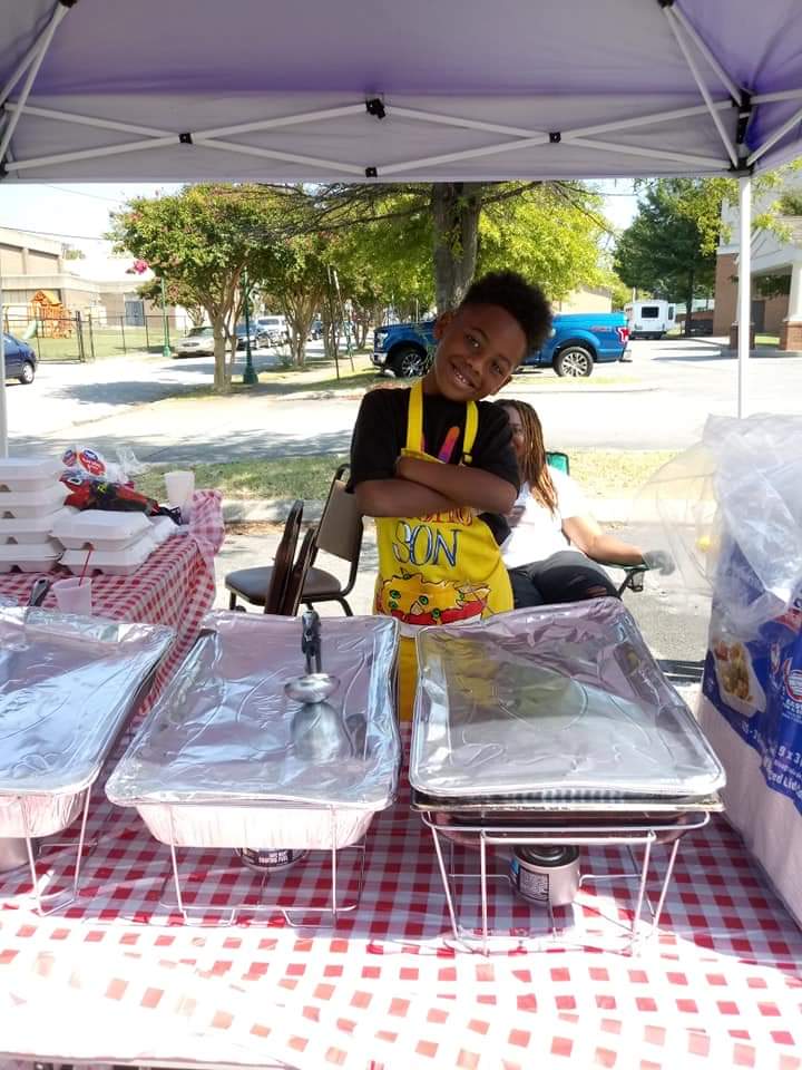 Contributed photo by Shea Jennings / Zi'on Jones of Nacho Son sells nachos at an event.