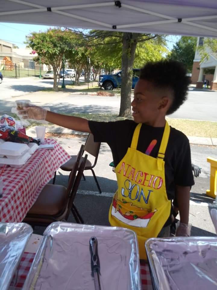 Contributed photo by Shea Jennings / Zi'on Jones of Nacho Son sells nachos at an event.