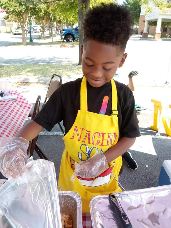 Contributed photo by Shea Jennings / Zi'on Jones of Nacho Son sells nachos at an event.