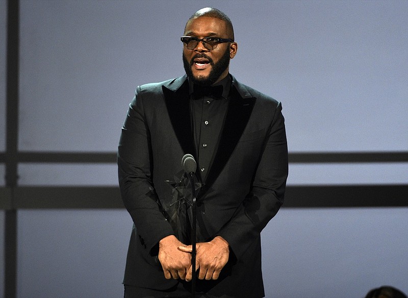 FILE - This June 23, 2019 file photo shows Tyler Perry accepting the ultimate icon award at the BET Awards in Los Angeles. (Photo by Chris Pizzello/Invision/AP, File)


