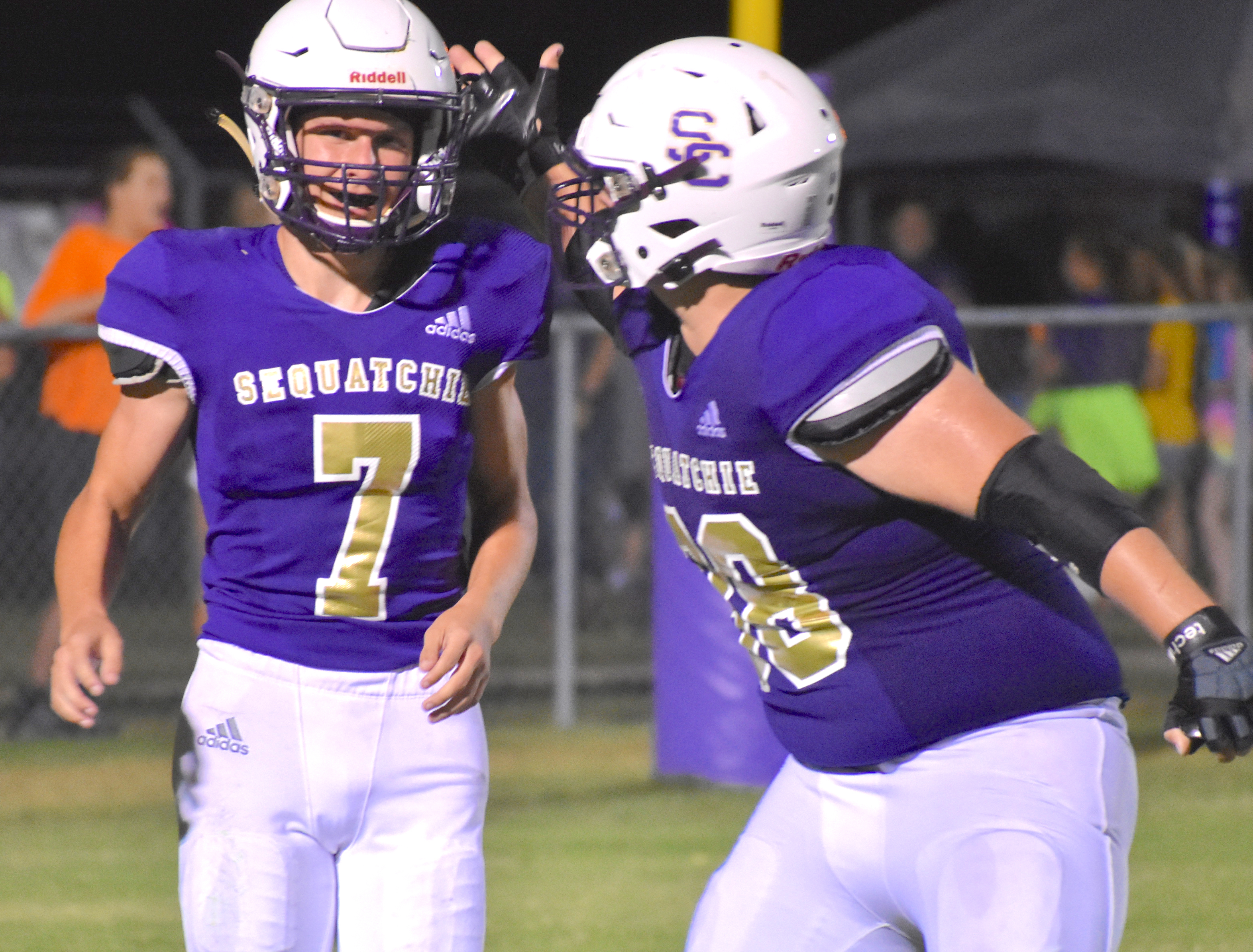 Staff photo by Patrick MacCoon / Sequatchie County quarterback Austin McCurry is congratuled by Ethan Grant after a 57-yard touchdown run in the third quarter. The Indians beat Bledsoe County for the seventh straight time with a 21-14 home win Friday night.