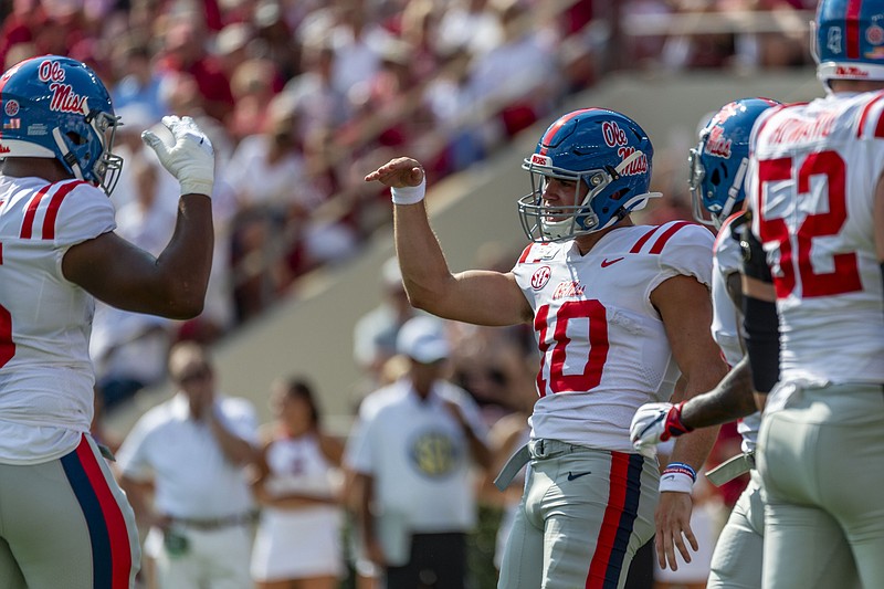 Associated Press photo by Vasha Hunt / Ole Miss quarterback John Rhys Plumlee (10) celebrates his touchdown run against Alabama during the first half of Saturday's game in Tuscaloosa, Ala.