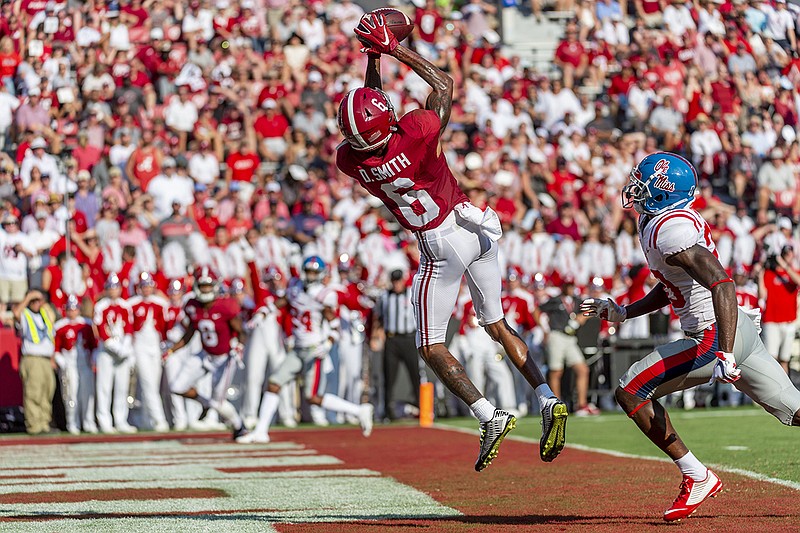 Associated Press photo by Vasha Hunt / Alabama wide receiver DeVonta Smith leaps for his fourth touchdown catch of the game well ahead of Ole Miss defensive back Keidron Smith during the first half Saturday in Tuscaloosa, Ala.