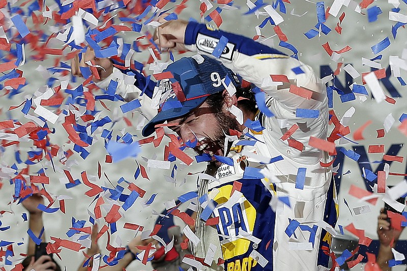 Associated Press photo by Gerry Broome / Chase Elliott celebrates Sunday in victory lane at Charlotte Motor Speedway after winning a NASCAR Cup Series playoff race.