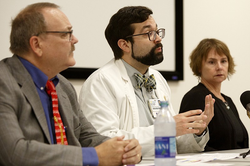 Staff photo by C.B. Schmelter / Pediatric pulmonologist Matthew Kreth, center, speaks during a press conference on vaping in the Frank P. Pierce Conference Center in the Children's Hospital at Erlanger's Kennedy Outpatient Center on Monday, Sept. 30, 2019 in Chattanooga, Tenn.