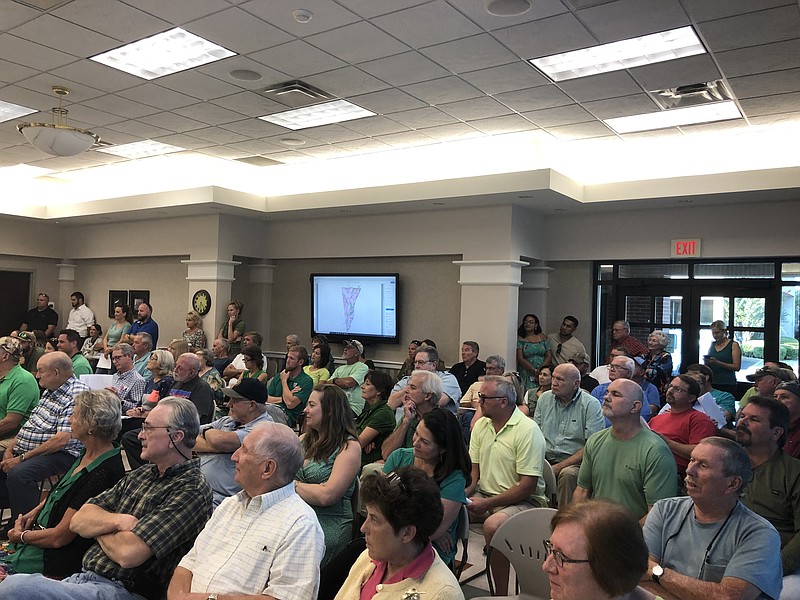 Dade County, Georgia, residents gather at a Dade County Commission public hearing about a proposed ordinance that would implement a requirement for applicants to obtain a special use permit for industrial development.