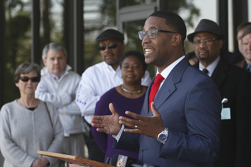 Patrick Hampton speaks to the media in front of Citizens For Government Accountability And Transparency campaign headquarters in 2014.