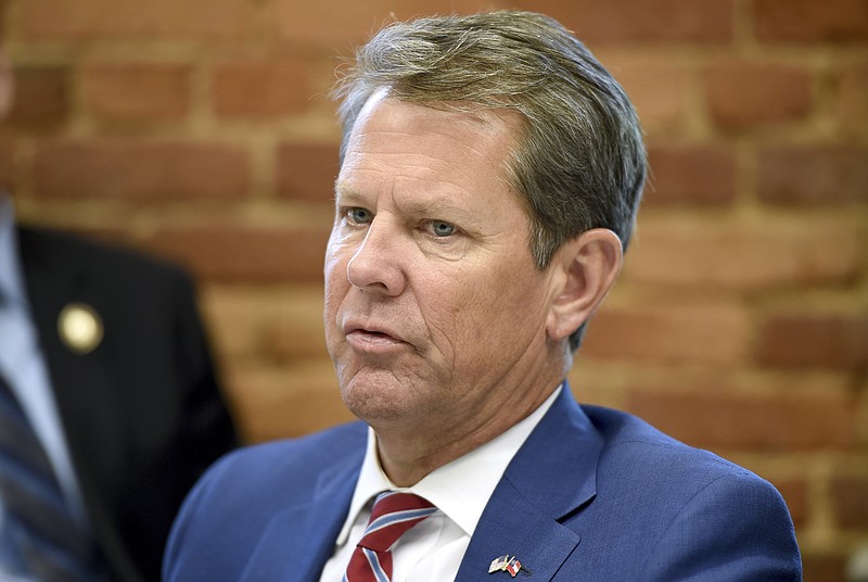 This July 2, 2019, file photo shows Georgia republican Governor Brian Kemp during a roundtable discussion on Georgia's healthcare challenges at Christ Community Health Center in Augusta, Ga. A federal judge on Tuesday, Oct. 1, 2019, temporarily blocked Georgia's restrictive new abortion law from taking effect, following the lead of other judges who have blocked similar measures in other states. The law signed in May by Kemp bans abortions once a fetal heartbeat is detected, which can happen as early as six weeks into a pregnancy, before many women realize they're expecting. It allows for limited exceptions. (Michael Holahan/The Augusta Chronicle via AP, File)
